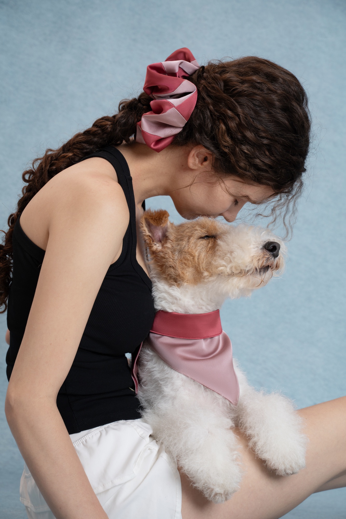 Woman and dog wearing the Rosé Bloom satin matching set